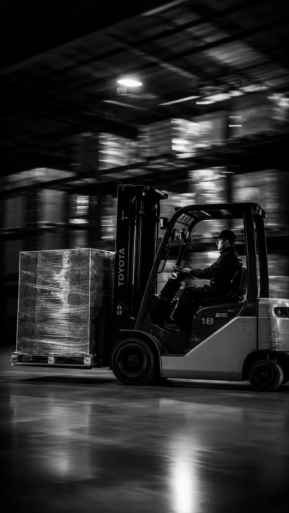 Forklift moving at speed through an industrial warehouse