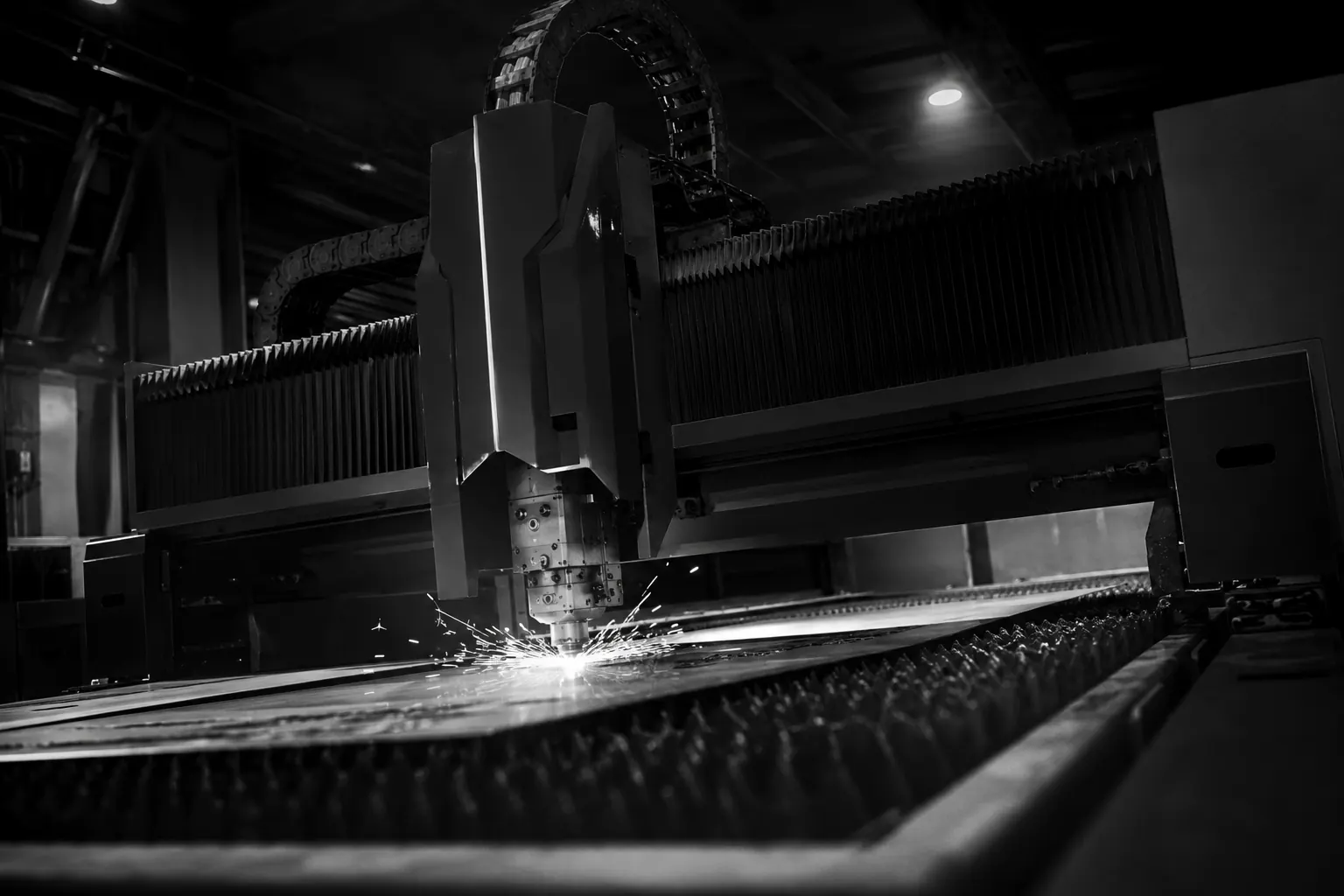 Sparks flying from grinding work in a dark workshop